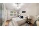 Bright bedroom with a ceiling fan, plush bedding, and stylish decor, creating a relaxing atmosphere at 1096 Liberty Nw Pkwy, Atlanta, GA 30318