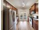 Galley kitchen with stainless steel appliances, dark cabinets and stone countertops, brightened by glass patio doors at 1096 Liberty Nw Pkwy, Atlanta, GA 30318