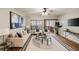 Open-concept living space with modern decor, hardwood floors, and sliding glass doors to the balcony at 1096 Liberty Nw Pkwy, Atlanta, GA 30318