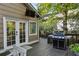 Cozy back deck with BBQ, french doors, outdoor tv and space to entertain guests with ease at 1111 Seaboard Nw Ave, Atlanta, GA 30318