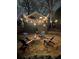 Atmospheric backyard featuring a fire pit, chairs, deck, and string lights for nighttime enjoyment at 1111 Seaboard Nw Ave, Atlanta, GA 30318
