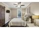 Cozy bedroom with a ceiling fan, natural light from window, and barn door to closet at 1111 Seaboard Nw Ave, Atlanta, GA 30318