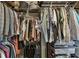 Walk-in closet with metal shelving and rods to store clothing at 1111 Seaboard Nw Ave, Atlanta, GA 30318