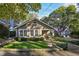 Charming bungalow with a manicured lawn and inviting front porch at 1111 Seaboard Nw Ave, Atlanta, GA 30318