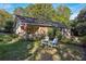 Charming home with a well-maintained front yard and inviting chairs for relaxing at 1111 Seaboard Nw Ave, Atlanta, GA 30318