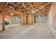 Unfinished basement featuring exposed ductwork, framing, and concrete flooring at 231 Beechwood Ln, Stone Mountain, GA 30087