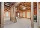 Unfinished basement featuring exposed beams, framing, and concrete floor at 231 Beechwood Ln, Stone Mountain, GA 30087