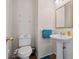 Cozy half-bathroom with pedestal sink at 231 Beechwood Ln, Stone Mountain, GA 30087
