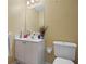 Bathroom with a single sink vanity and standard toilet at 231 Beechwood Ln, Stone Mountain, GA 30087