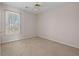 Carpeted bedroom with standard closet and single window at 231 Beechwood Ln, Stone Mountain, GA 30087