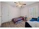 Bright bedroom with a hardwood floor, window, and compact furnishings at 231 Beechwood Ln, Stone Mountain, GA 30087