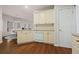 Updated kitchen area with white cabinets and countertops and stainless steel dishwasher at 231 Beechwood Ln, Stone Mountain, GA 30087