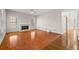 Spacious living room with hardwood floors, fireplace, and large windows at 231 Beechwood Ln, Stone Mountain, GA 30087