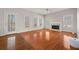 Bright and airy living room with hardwood floors, fireplace, and rear door access at 231 Beechwood Ln, Stone Mountain, GA 30087