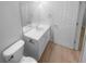 Bright bathroom featuring a modern vanity with a white countertop and neutral wall paint at 1446 Dunton Green Way, Lawrenceville, GA 30043