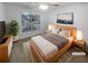 Cozy bedroom featuring soft carpet, a bright window, and stylish decor, creating a relaxing atmosphere at 1446 Dunton Green Way, Lawrenceville, GA 30043