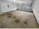 Spacious two-car garage with an automatic door and ample room for parking and storage at 1446 Dunton Green Way, Lawrenceville, GA 30043