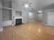 Spacious living room with hardwood floors, a fireplace, and ample natural light at 1446 Dunton Green Way, Lawrenceville, GA 30043