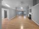 Expansive living room with hardwood floors, offering versatile space for living and dining with lots of light at 1446 Dunton Green Way, Lawrenceville, GA 30043