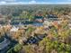 Wide aerial view of homes surrounded by lush trees and busy roadways at 1532 Oak Grove Rd, Decatur, GA 30033