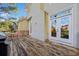 Spacious wooden deck with outdoor furniture and french doors leading inside at 1532 Oak Grove Rd, Decatur, GA 30033