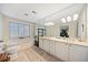Elegant bathroom with a large mirror, double sink vanity, and soaking tub next to a large window at 1532 Oak Grove Rd, Decatur, GA 30033