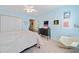 Charming bedroom with blue walls, a double door closet, and light-colored carpet floors at 1532 Oak Grove Rd, Decatur, GA 30033