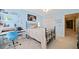 Bedroom with light blue walls, carpet flooring, and a black wrought iron bed at 1532 Oak Grove Rd, Decatur, GA 30033