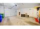 Spacious two-car garage with a concrete floor, storage shelving, and overhead lighting at 1532 Oak Grove Rd, Decatur, GA 30033