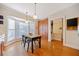 Bright eat-in kitchen with wood cabinets, trim, pendant lights, and natural light at 1532 Oak Grove Rd, Decatur, GA 30033