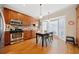 Eat-in kitchen boasts wood cabinets, stainless steel appliances, and ample natural light from large windows at 1532 Oak Grove Rd, Decatur, GA 30033