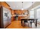 Spacious eat-in kitchen with stainless steel appliances, wood cabinets, and wood floors at 1532 Oak Grove Rd, Decatur, GA 30033