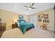 Serene main bedroom with tray ceiling, soft carpeting, and a large window for natural light at 1532 Oak Grove Rd, Decatur, GA 30033