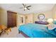 Bright bedroom with a ceiling fan, closet, and dresser, complemented by a chair, offering both comfort and functionality at 1532 Oak Grove Rd, Decatur, GA 30033