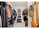 Spacious walk-in closet features built-in shelving and clothing racks, offering ample storage for your wardrobe needs at 1532 Oak Grove Rd, Decatur, GA 30033