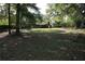 This home has a large backyard with mature trees, and a partial view of the house at 2491 Hatfield Cir, Atlanta, GA 30316