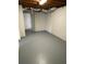 Spacious basement area features concrete floors, exposed ceiling, and access to other rooms for potential expansion at 2491 Hatfield Cir, Atlanta, GA 30316
