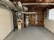 Basement area with exposed duct work, a water heater and an older HVAC system at 2491 Hatfield Cir, Atlanta, GA 30316
