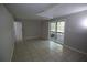 The basement has tile flooring and a sliding glass door with security bars at 2491 Hatfield Cir, Atlanta, GA 30316