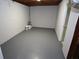 Spacious basement area featuring painted concrete floors and white block walls, offering ample storage at 2491 Hatfield Cir, Atlanta, GA 30316