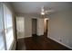 This bedroom has a ceiling fan, windows for natural light, and hardwood floors at 2491 Hatfield Cir, Atlanta, GA 30316