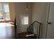 Entryway with hardwood flooring and railing, featuring a large window for natural light at 2491 Hatfield Cir, Atlanta, GA 30316