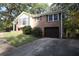 Split-level home showing brick and vinyl siding, with an integrated garage at 2491 Hatfield Cir, Atlanta, GA 30316