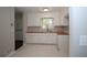This kitchen features white cabinets, butcher block countertops, and a garden window at 2491 Hatfield Cir, Atlanta, GA 30316