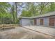 Spacious backyard patio with picnic table and exterior of a gray brick home at 2797 Gresham Se Rd, Atlanta, GA 30316