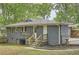 View of the backyard and the exterior of this quaint single Gathering home with an open yard at 2797 Gresham Se Rd, Atlanta, GA 30316