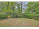 Large backyard with green grass and mature trees, offering a private outdoor space at 2797 Gresham Se Rd, Atlanta, GA 30316