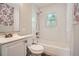 Cozy bathroom with subway tile, shower/tub combo, and floral wallpaper at 2797 Gresham Se Rd, Atlanta, GA 30316