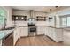 Modern kitchen featuring stainless steel appliances, granite countertops, and hardwood flooring at 2797 Gresham Se Rd, Atlanta, GA 30316
