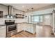 Open kitchen featuring stainless steel appliances, a kitchen island and hardwood floors at 2797 Gresham Se Rd, Atlanta, GA 30316
